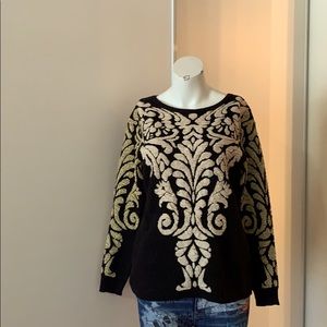 Spanner sweater with gold details on sleeves